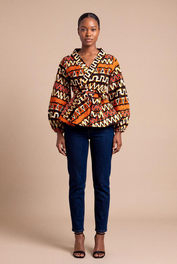 Haut wax africain Oumou portefeuille motif graphique brun et orange manches bouffantes