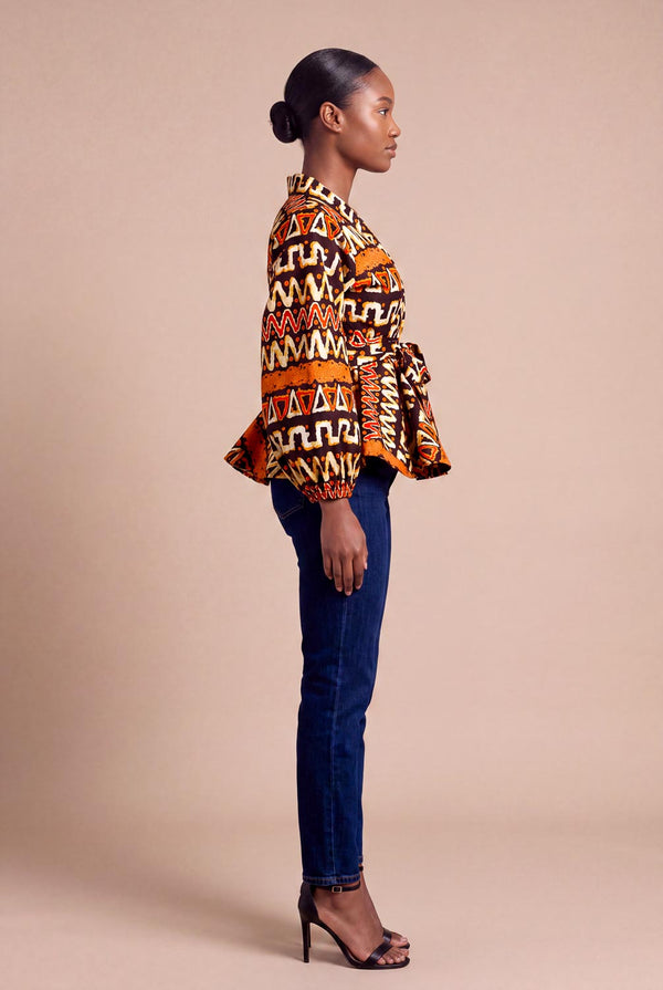 Haut wax africain Oumou portefeuille motif graphique brun et orange manches bouffantes