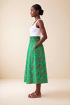Jupe wax africaine Fanta motif géométrique vert et orange taille haute smockée