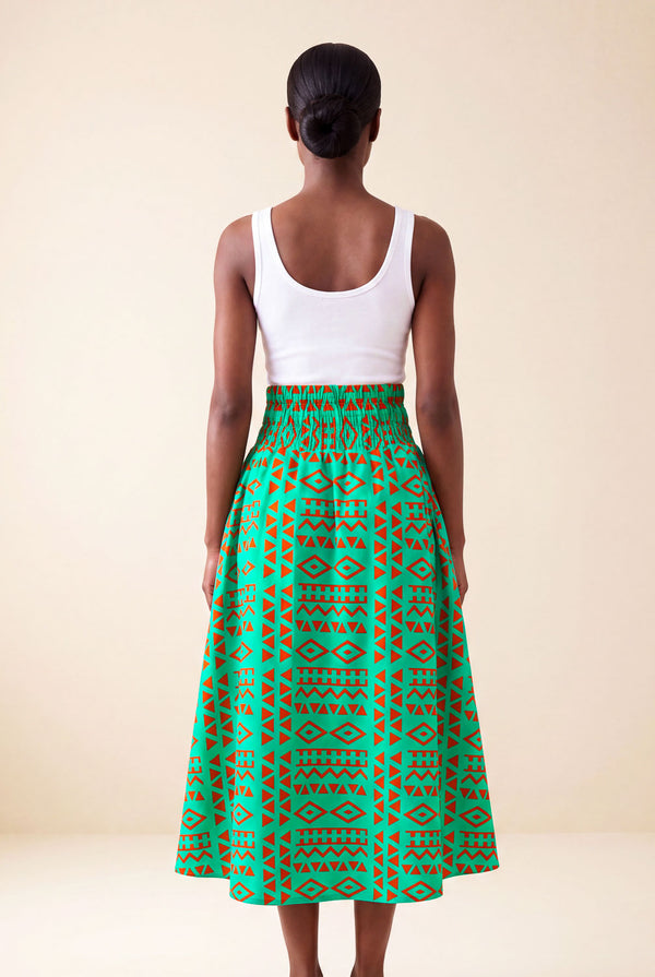 Jupe wax africaine Fanta motif géométrique vert et orange taille haute smockée