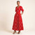 Robe Neema portefeuille en wax rouge et blanc avec poches